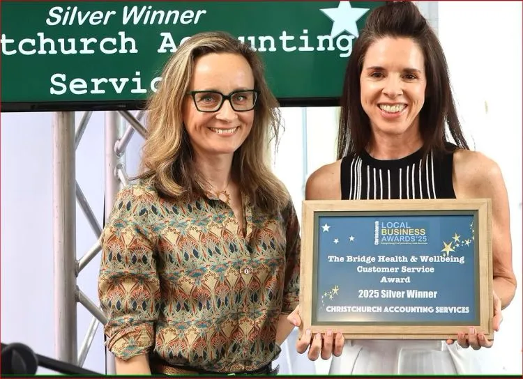 Eloise with the presenter and her Local Business Awards 2025 Silver Winner plaque