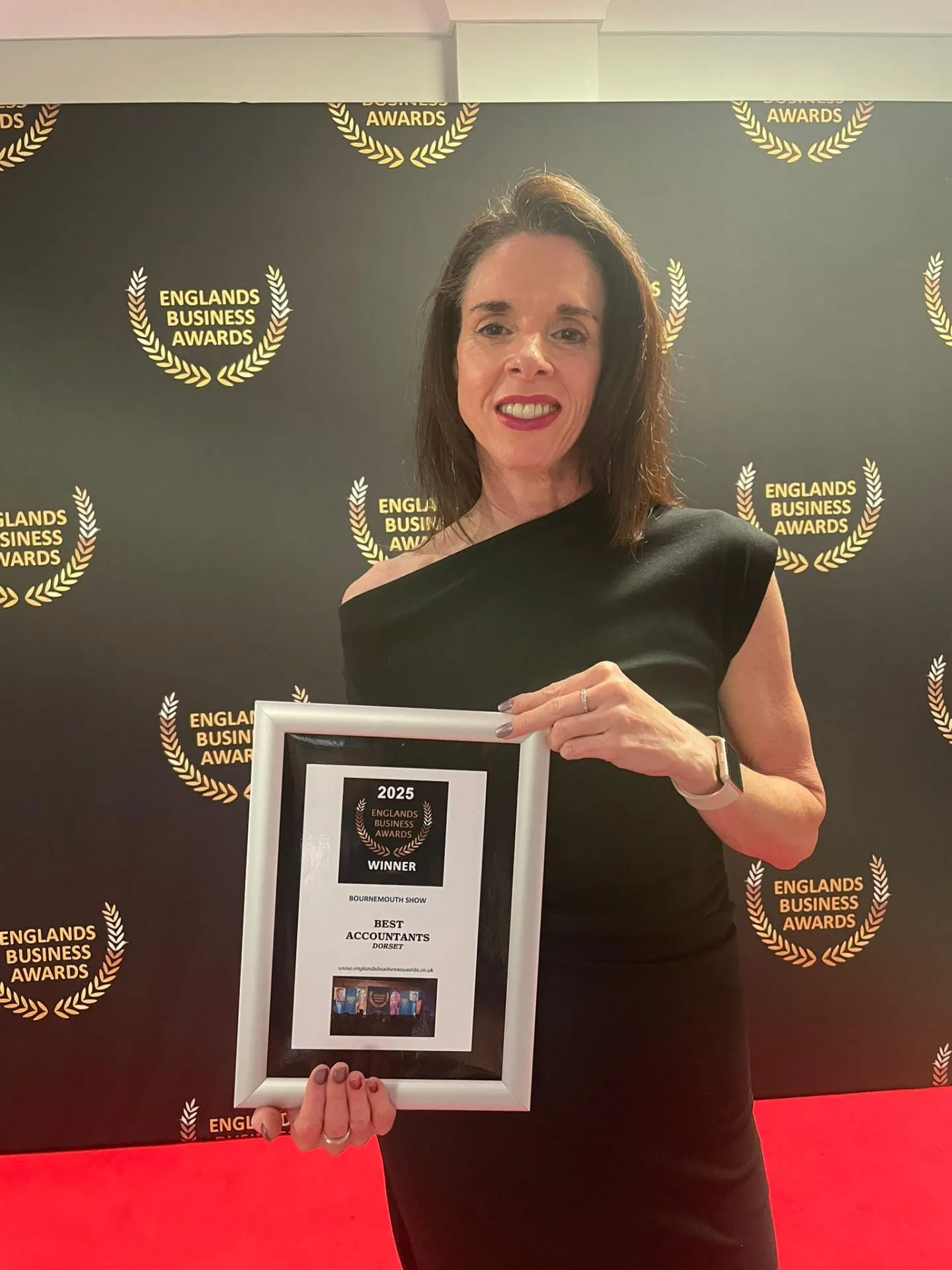 Eloise holding her Englands Business Awards 2025 plaque, Best Accountants, Dorset
